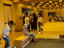 Check in, you sit on the little benches to the left, take off your shoes and store them in lockers.
