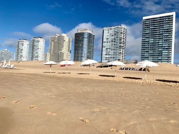 There are some buildings like this that line parts of the beach. But not crazy crowded.