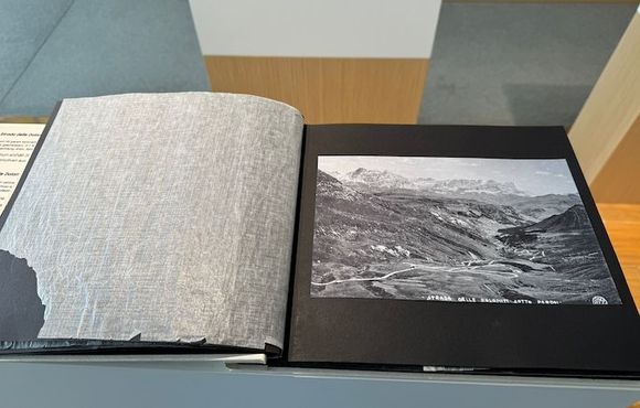 Old book of silver gelatin prints of photos from the Strada Dolomiti (Great Dolomite Road)