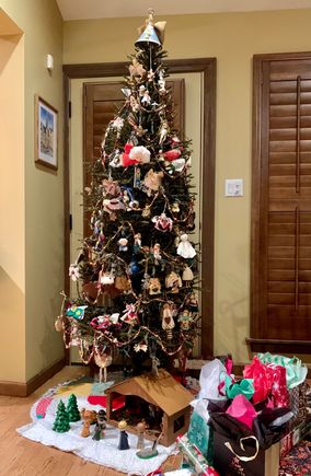 Decorated exclusively with angel ornaments, many now from around the world. Incredibly, she can remember where each one came from. She is Percy-like in that regard. But I hate it when she asks me to tell her their origin because I have a very crappy memory.