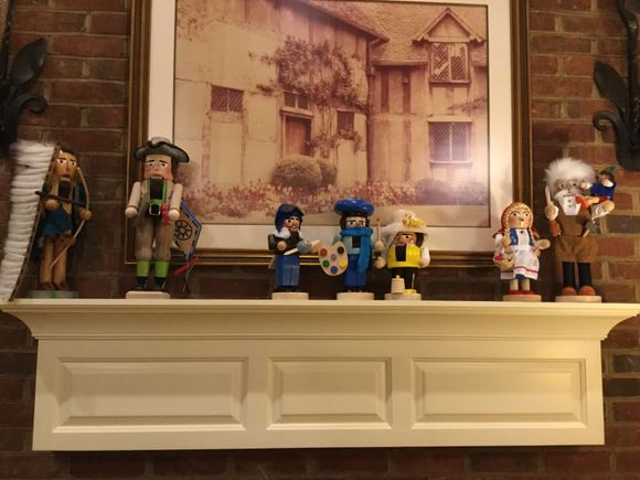 
Library mantel holds some of my favorites:  Native American chief, Ben Franklin,  a pilot, artist and beekeeper,  Little Red Riding Hood and gepetto holding Pinocchio.
