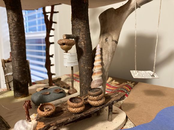 Kitchen with bowls, and tree swing on the right 