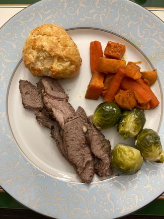 Roasted lamb, sweet potatoes and carrots, Brussels sprouts, and cheddar biscuits 