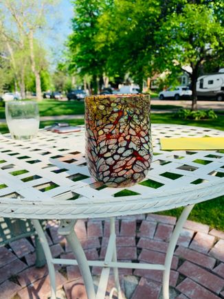 Glass made by a friend. Graduation card on the table for across the street neighbor. 