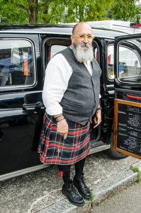This person was a knife-sharpener at the Quimper weekly market. He worked from his vintage taxi vehicle. That Saturday was a busy day in that town. An outdoors table tennis tournament was also being held in the main St. Corentin Cathedral square 'Eveche' space. The permanent children's rides there had thus been supplemented by modern music, an announcer plus inflated arches above the ping pong tables. That same Saturday was also the twice-annual Braderie 'bric a brac' market. Busy busy busy.