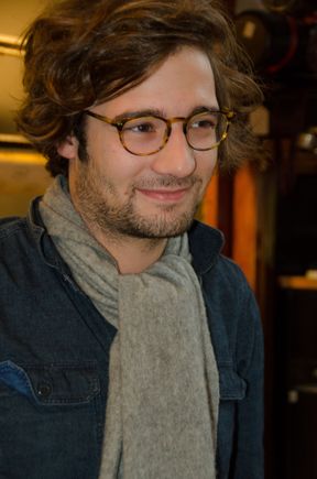 Young manager of Parisian art shop.