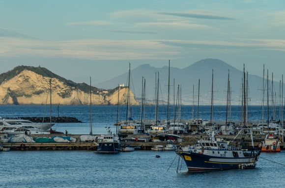 I think that maybe the bluffs in the foreground are Cape Miseno, once site of WWII defense guns. At this very moment, our return ferry back to ischia had just launched. We went atop to enjoy the marvelous, if breezy, atmosphere.