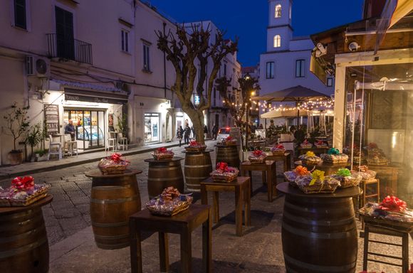 Just outside our rental: a shoulder season night scene along Ponte's main drag.