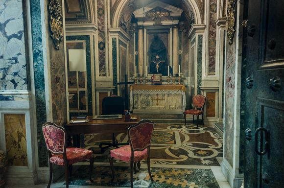 A sealed-off side room, where the Pope and others have met.