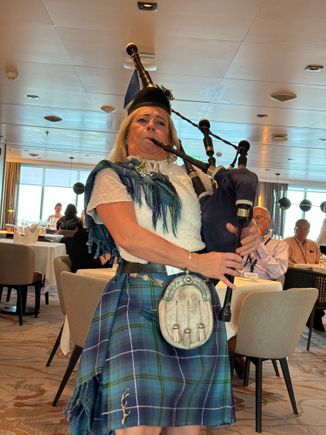 Serenaded at dinner by a famous female pipe player 