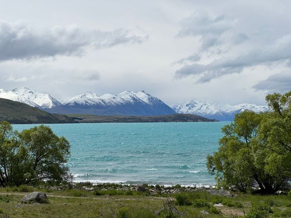 Love the turquoise waters against the snow-covered mountains!