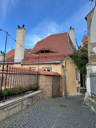 Street scene of Sibiu - with a giant eye watching over you!