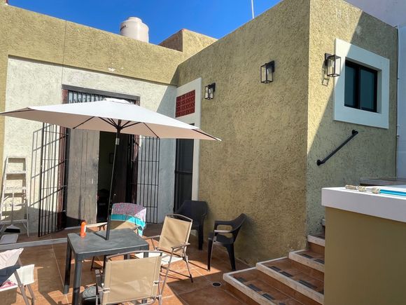 Great patio with pool on the right.  I've been in it three times today.  It's hot here.