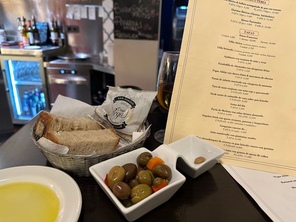 Bread, olives and the menu, which is augmented by the daily specials
