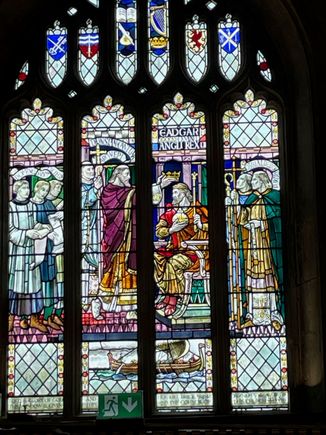 In the middle you can see King Edgar, the first English king being crowned here in the Bath Abbot, Cathedral at the time.  I think it was summer because if he had been crowned in January, he would have been known as King Edgar Winter