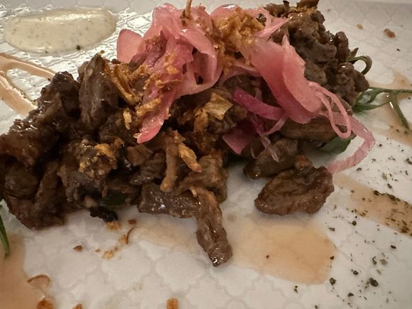 These are strips of pork with caramelized red onion glazed with a Negroamaro sauce--it was fantastic but we could not finish the entire dish.   (might order this again tomorrow!!)