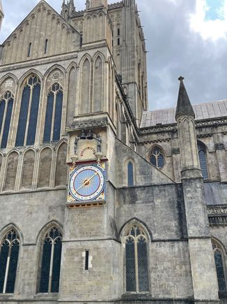 Big historic clock outside of the Cathedral on the east wall
