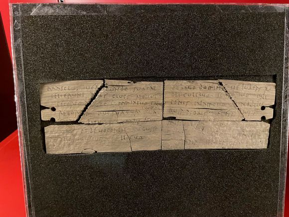 One of the ink tablets.  i won't attempt to describe the process of retrieving the letters.  This on was an invitation to a party and its says, "Please don't bring your famous deviled eggs, they give Claudius gas."