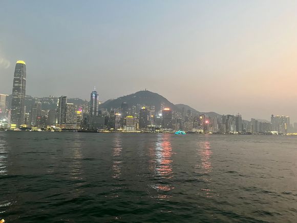 View of HK Island across Victoria Harbor from West Kowloon at Dusk