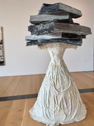 One room was devoted to wedding dresses. He replaced all the heads of the women, who were all well known in their day, with items representing them and their story. This is depicting a women on Lesbos and her love of learning and poetry about her sexuality. Those "book" weigh a ton, literally!