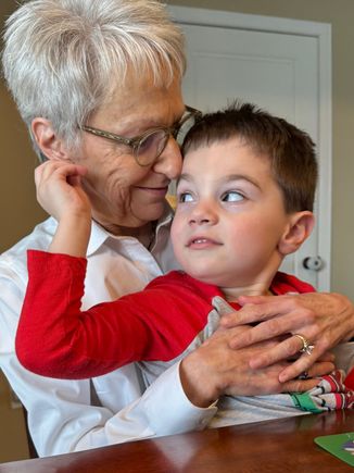 We brought lunch from a BBQ restaurant, but he wasn’t interested in eating anything. But he didn’t mind climbing onto Joyce’s lap anyway!