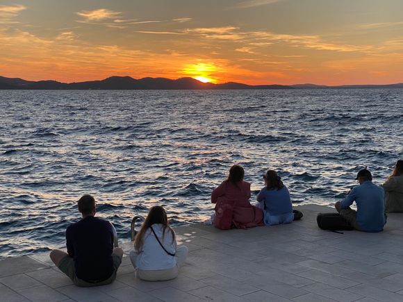Listening to the Sea Organ at sunset - a perfect evening activity in Zadar