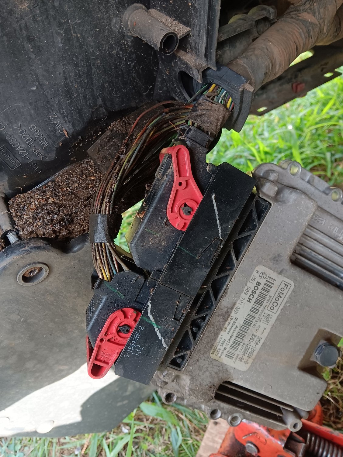 Why put an ECM in the wheel well?