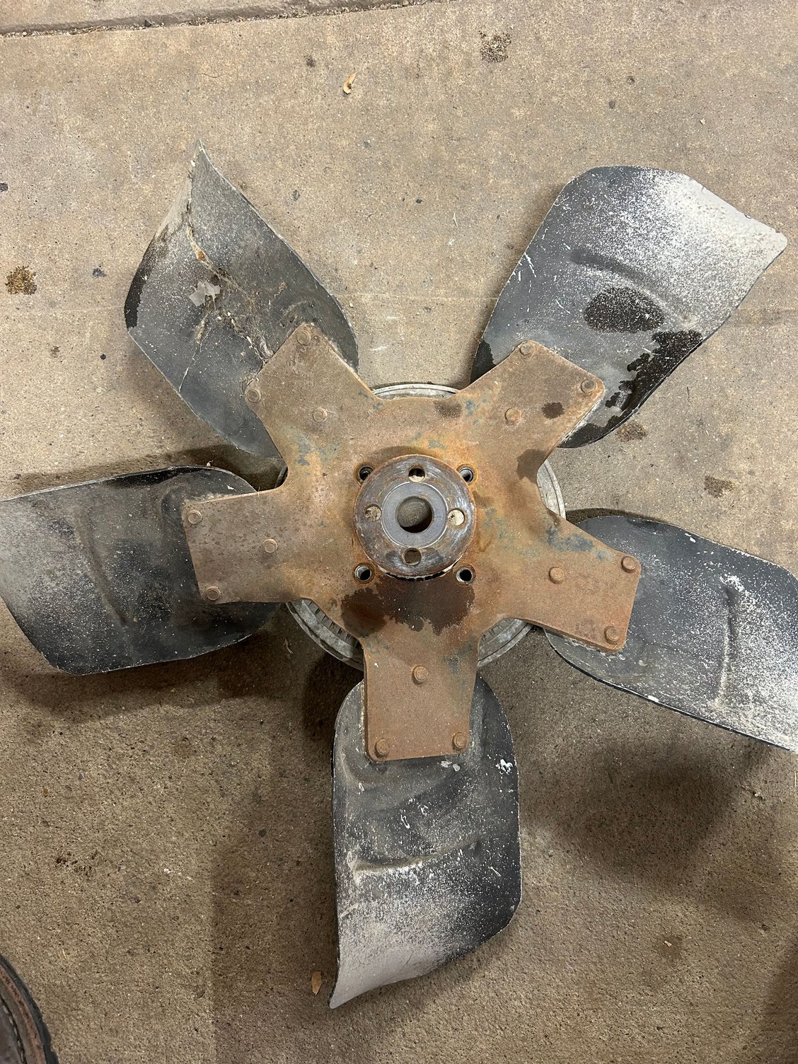 I also went ahead and started cleaning parts and the parts washer while I was at it. I grabbed the fan and unbolted it from the clutch. Just to clean it up it had some mud Dobbers in the clutch fins and I want to give a quick clean to the fan. I�m gonna blast this and then paint it but that�ll have to be for another day. It just got a light cleaning.