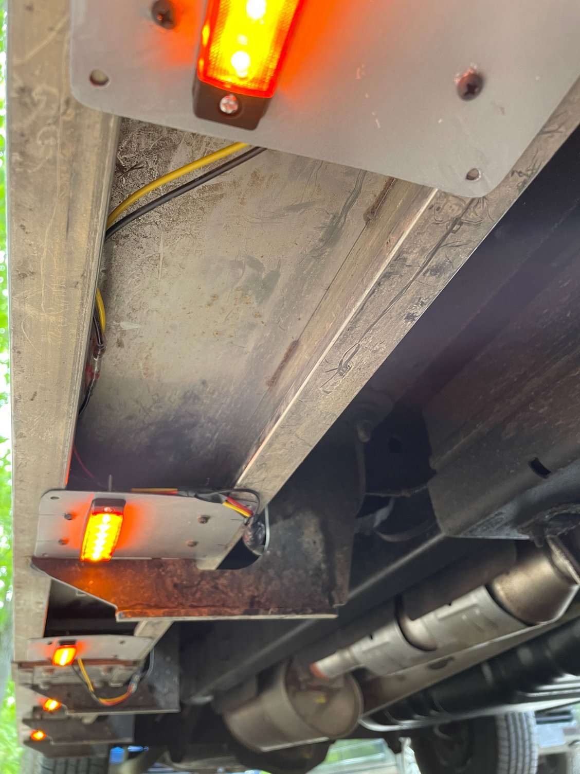 Puddle lamps mounted to right side running board