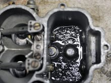 Remove the top of your carb and look inside.  If it looks like this you need to clean the entire system and install an inline filter between the fuel pump and the carb.