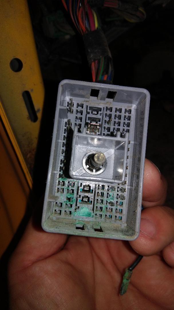 Identify this connector, mounted below parking brake Ford Truck