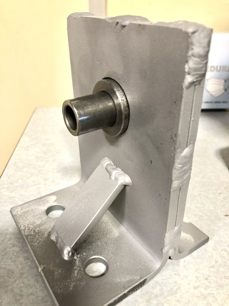 Because I doubled the thickness of the frame brackets, I had to lengthen the the metal bushing in the center of the polyurethane mount.