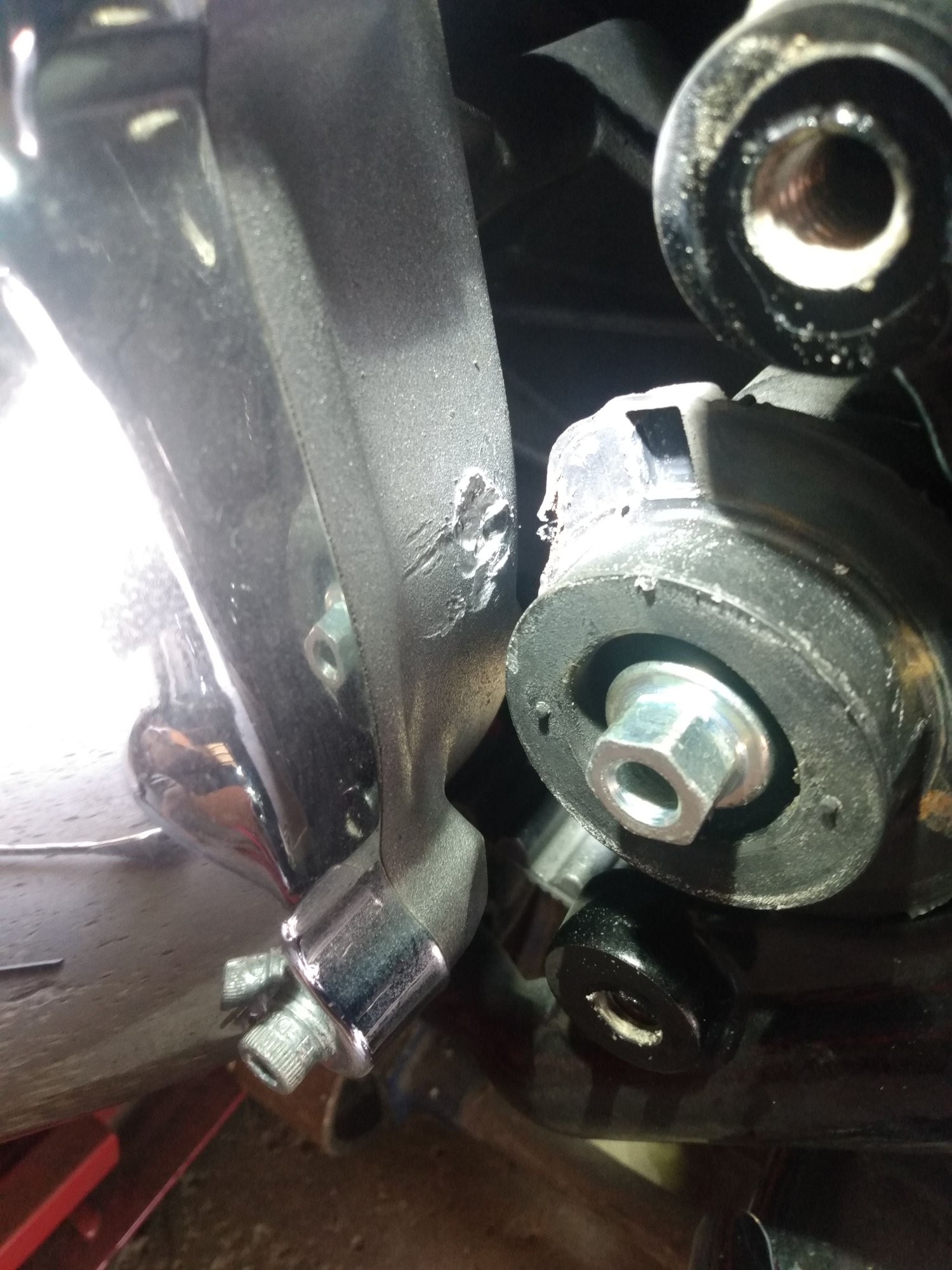 Mount for swingarm bushing hitting trans case. How can this happen