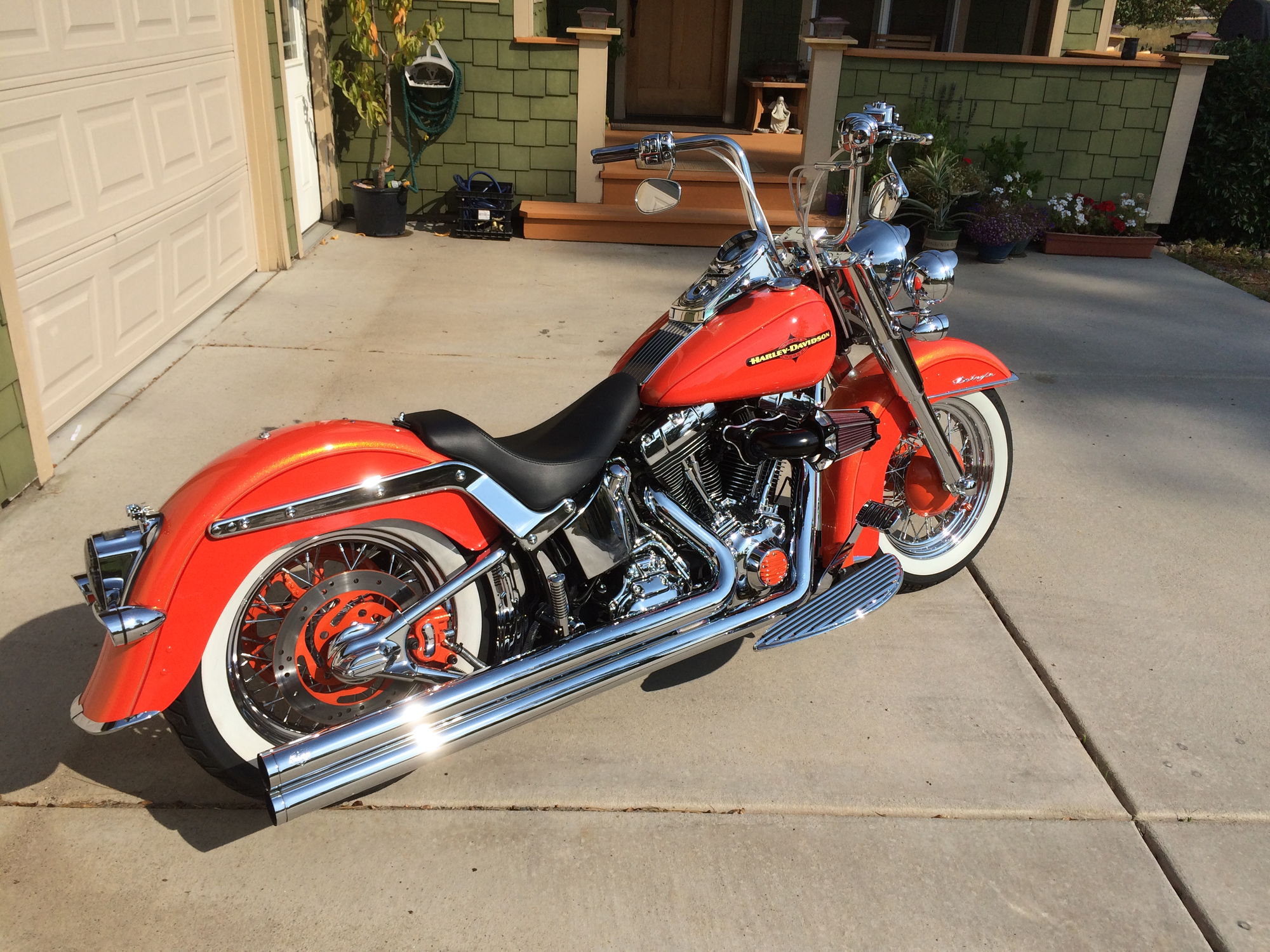 Harley davidson motorcycle is a 2009 flstn softail deluxe with 18 inch ape hangars...