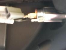 on the left was the stock wire connector, I just used a small dental pick spring hook and released the wires from it and sliped them on the cig lighter connectors. Fit right on. They are tight too. OEM was not water proof I figure the faring must protect em