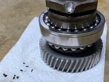 Plastic pieces broke off from the ball bearing cage when removing the bearing