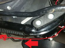 down from cooler, along fram rail w/ power trunk
