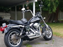 My bike after installing the 2003 FXDWG triple tree and forks. Installed 16" front tire of a 2003 Road King..