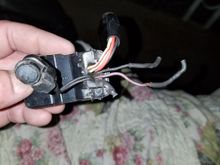 The two wires poking out to the right that still have the heat shrink on them are the two that i snipped to remove the mirror. They will be the two that i need to lengthen and feed back through the bars to provide power to my new turn signal. I will have to break out my meter tomorrow and start testing.