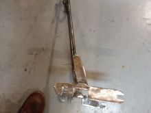 Rasp at the bottom, angle iron between it and rebar.