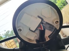 Unplug the cable connected to the speedometer