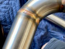 Overspray all over exterior of pipes (black speckles)