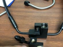 Distribution port for ABS module (not needed, except for the mounting hole (in white)