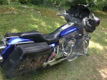 Here is a pick of my '97 FLHT.  I bought it in '99, my first HD.  I'll never get rid of it!  since this pic, i have ditched the Hypercharger for a Ness Big Sucker and stock EVO air cleaner cover. This was my fist candy paint job (House of Kolor Cobalt Blue over a Shimmerin' Silver base and lots of clear).