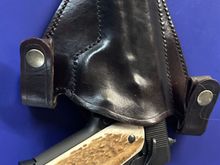 This is a properly formed IWB holster. I’ve carried it, as well as others like it long enough to be convinced beyond a shadow of a doubt that is has more than enough retention so as to never present a problem.

If a strap makes you feel better, then by all means, go for it, but it is not necessary if you have a properly constructed holster.