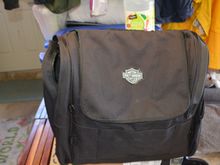 Front side flap over closure and large pockets on sides