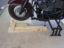 The extra length of 2X8 tied to the front roll up keeps the Jiffy Stand at the same level as the wheels 