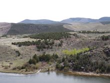 Little Hole looking SE toward Diamond Mt. The strange Pinion and Juniper patterns were caused by wild fires.