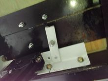 Here is one of the mounting brackets I made for the stabilizer jacks. They were too long to swing down if mounted to the bottom of the frame, so I tucked them up two inches along side the frame in the back corner.   They work pretty darn good. Those bolts sticking down through the floor that I braced off of are from the D-ring above.