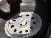 The weight of the wheel/tire mostly sits on the holder.  LOOSEN YOUR MOUNTS BEFORE ADDING AIR TO THE TIRE!!!  Don't ask how I know...
